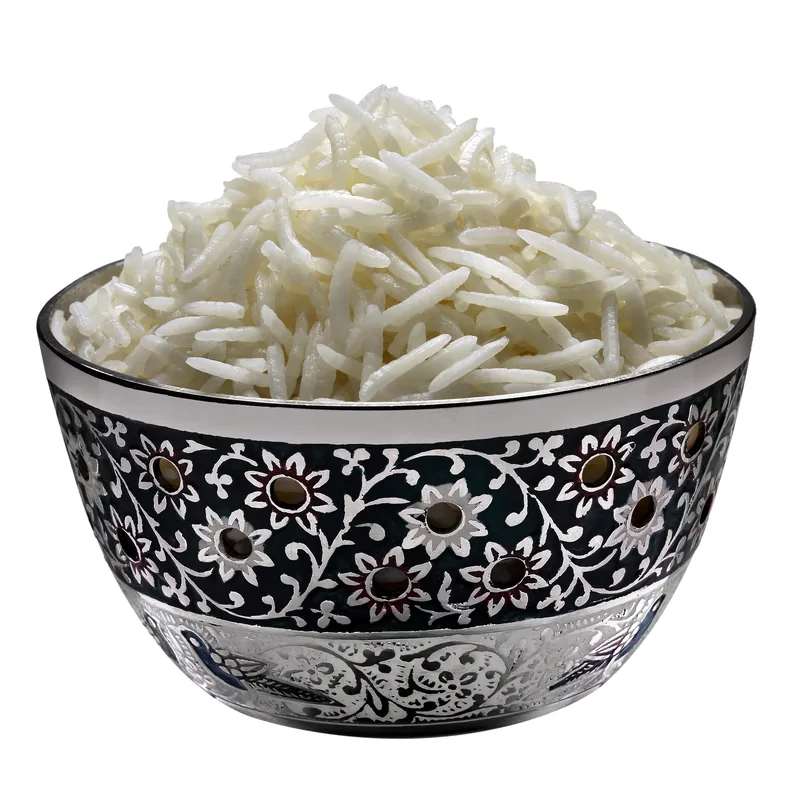 Sugandha basmati rice spread on a green surface